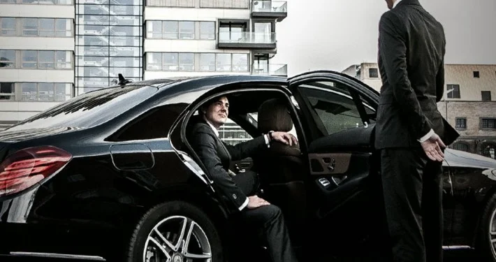 VIP transfer Istanbul Mercedes S-Class with chauffeur opening the door for guest