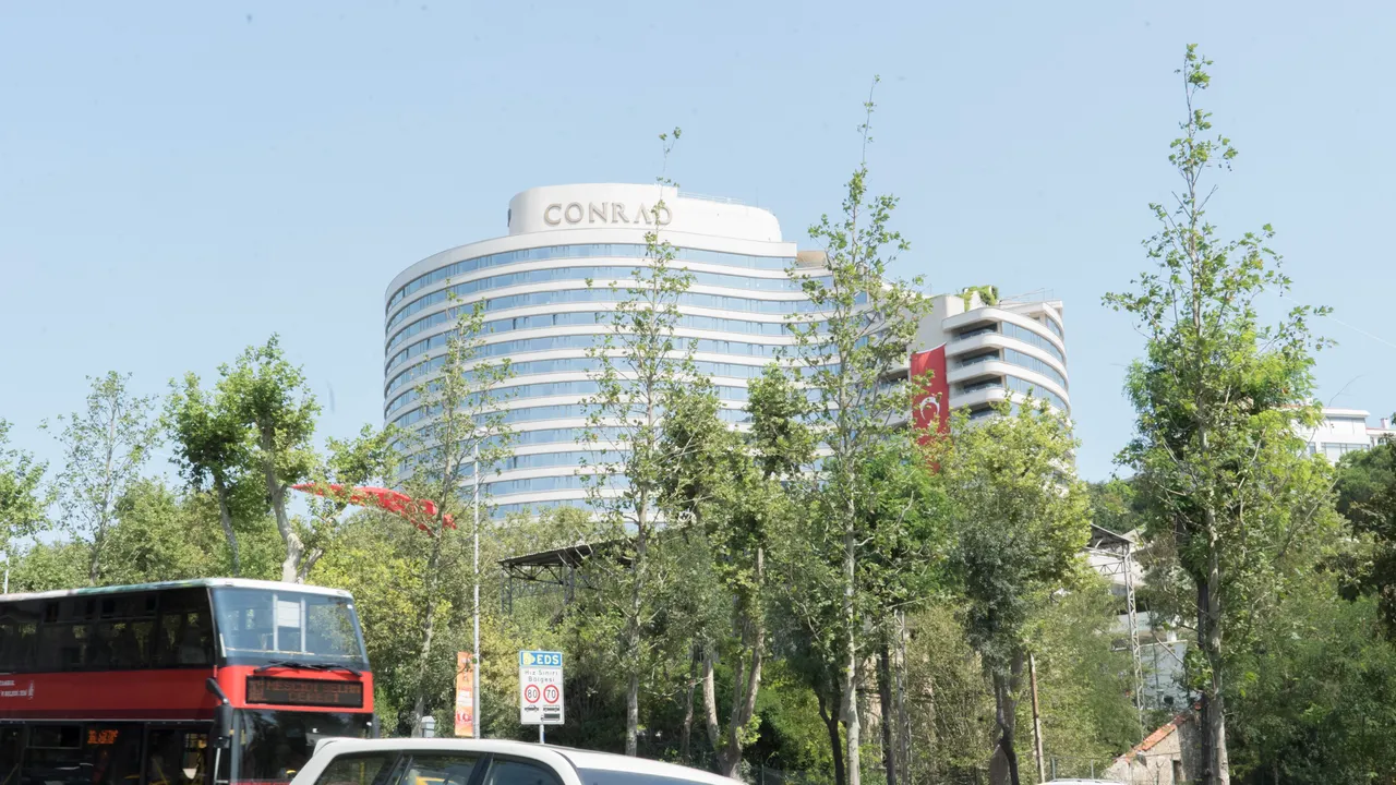 Conrad Istanbul Bosphorus exterior above trees in an archival 2017 photograph